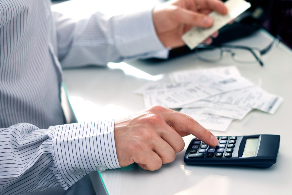 Businessman counting bills. Work in office