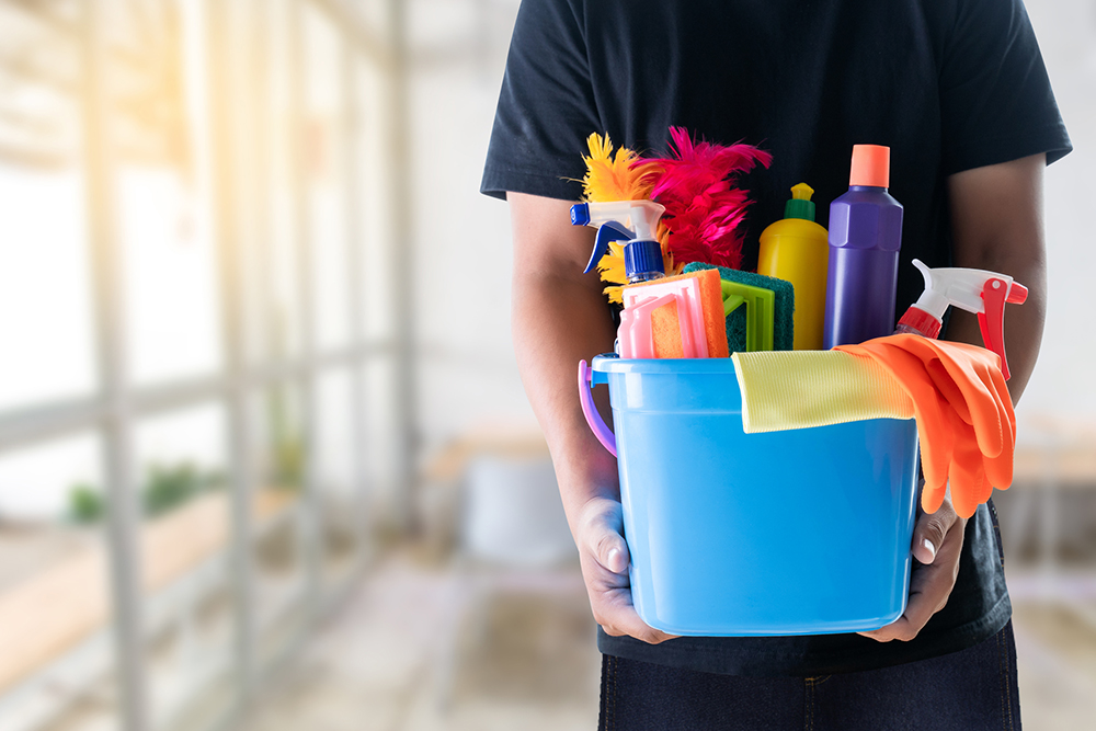 man cleaning service concept clean room and office tools